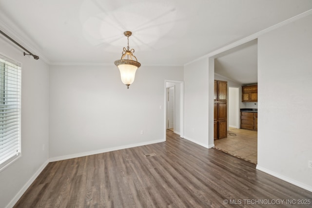 11462 Red Fox Ln, Sperry, OK 74073 - unfurnished room with wood finished floors, plenty of natural light, ornamental molding, baseboards, and vaulted ceiling
