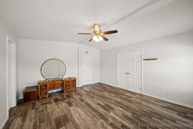 11462 Red Fox Ln, Sperry, OK 74073 - unfurnished bedroom with dark wood finished floors, a closet, baseboards, a ceiling fan, and lofted ceiling