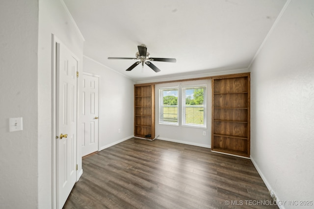 11462 Red Fox Ln, Sperry, OK 74073 - spare room featuring ornamental molding, dark wood-style flooring, ceiling fan, and baseboards