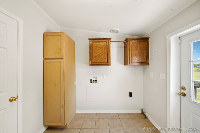 11462 Red Fox Ln, Sperry, OK 74073 - clothes washing area with hookup for a washing machine, light tile patterned floors, cabinet space, baseboards, and crown molding