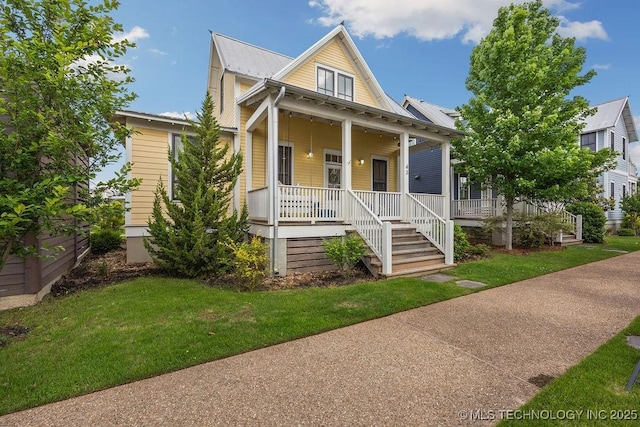43 Center Ln S, Carlton Landing, OK 74432 - view of front of home featuring covered porch, a front yard, and metal roof