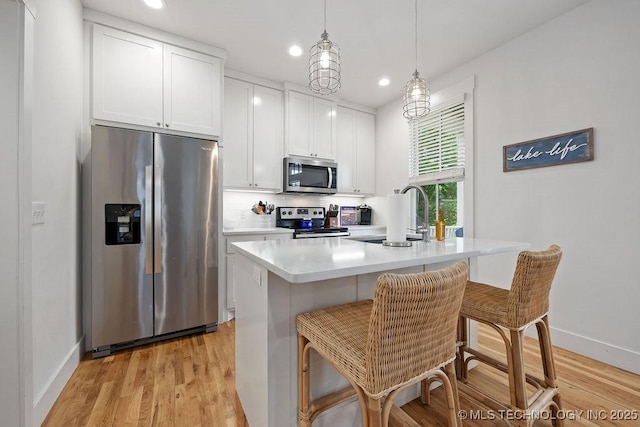 43 Center Ln S, Carlton Landing, OK 74432 - kitchen featuring appliances with stainless steel finishes, a sink, white cabinets, baseboards, and recessed lighting