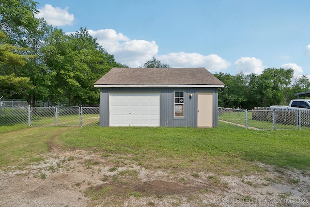 detached garage featuring a gate