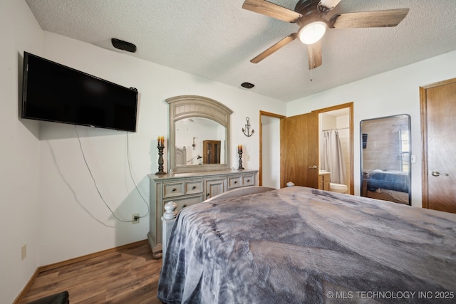 bedroom featuring wood finished floors, a textured ceiling, a ceiling fan, baseboards, and connected bathroom