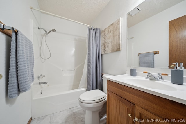 bathroom featuring toilet, shower / tub combo with curtain, vanity, and a textured ceiling