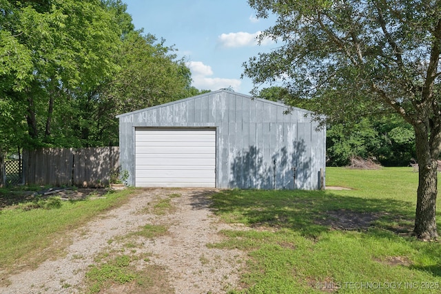 view of outbuilding featuring driveway and an outbuilding