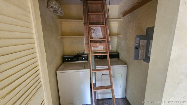clothes washing area featuring washing machine and clothes dryer