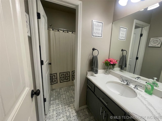 full bathroom with vanity and a shower with curtain