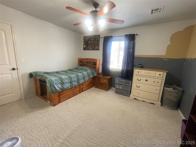 bedroom with light carpet and ceiling fan