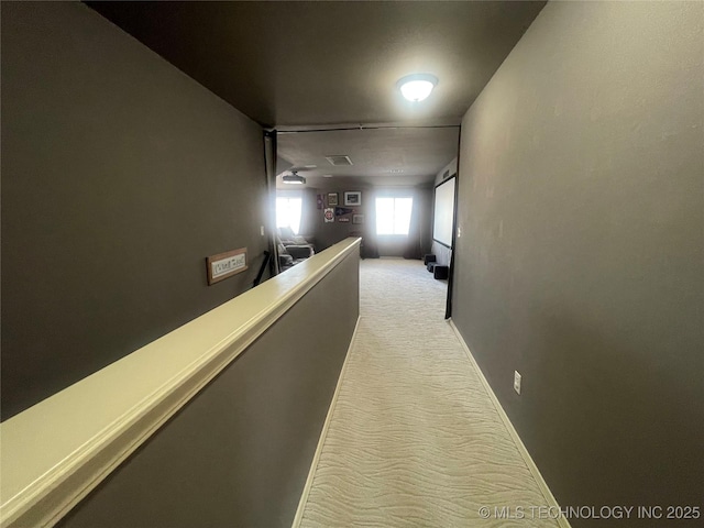 corridor with light carpet
