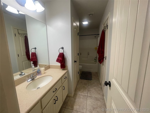 full bath featuring tile patterned floors, vanity, and  shower combination