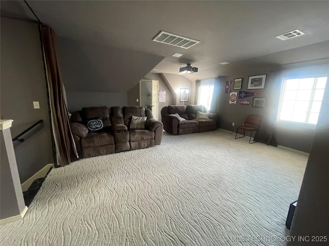 home theater featuring vaulted ceiling and carpet floors