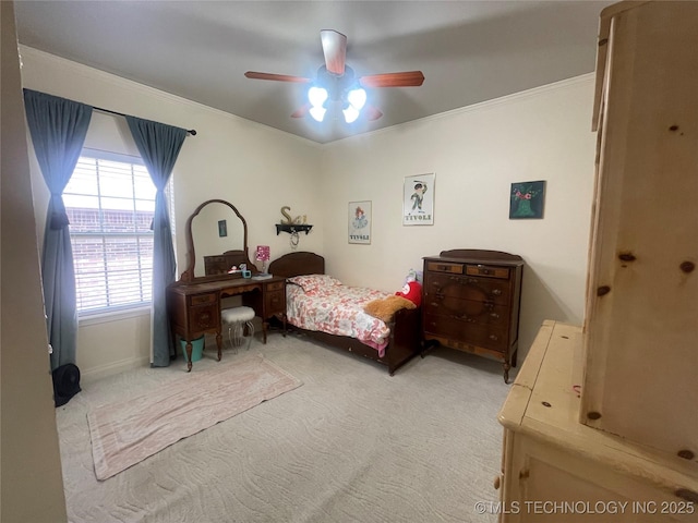 bedroom with light carpet, crown molding, and a ceiling fan