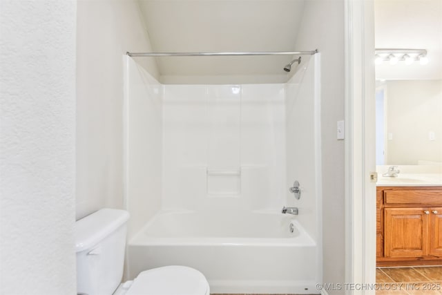 full bath featuring toilet, shower / washtub combination, and vanity