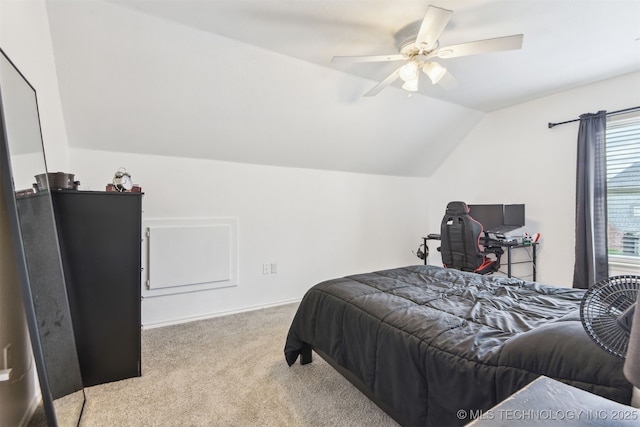 carpeted bedroom with lofted ceiling and a ceiling fan