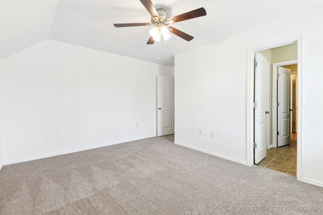 unfurnished bedroom featuring carpet floors, baseboards, and ceiling fan