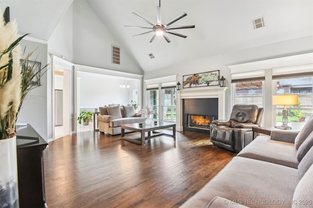 3909 W Utica St, Broken Arrow, OK 74011 - living room featuring high vaulted ceiling, plenty of natural light, a tile fireplace, a ceiling fan, and dark wood finished floors