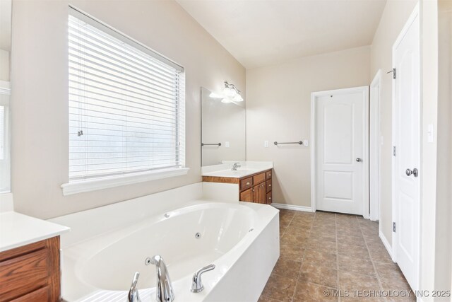 3909 W Utica St, Broken Arrow, OK 74011 - full bath featuring vanity and a tub with jets