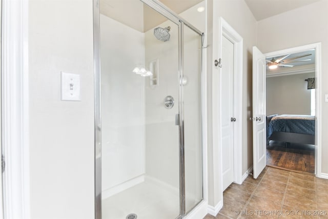 3909 W Utica St, Broken Arrow, OK 74011 - ensuite bathroom featuring a stall shower, a ceiling fan, and baseboards
