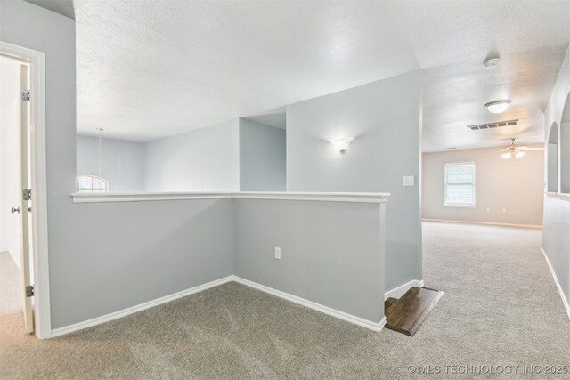3909 W Utica St, Broken Arrow, OK 74011 - carpeted empty room with a ceiling fan, baseboards, a textured ceiling, and a smoke detector