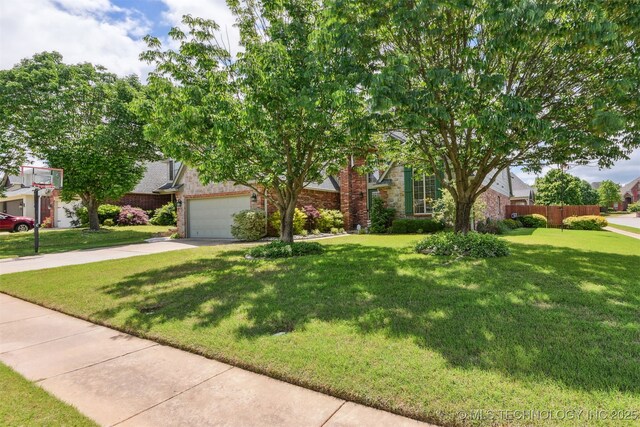 3909 W Utica St, Broken Arrow, OK 74011 - obstructed view of property with brick siding, concrete driveway, and a garage