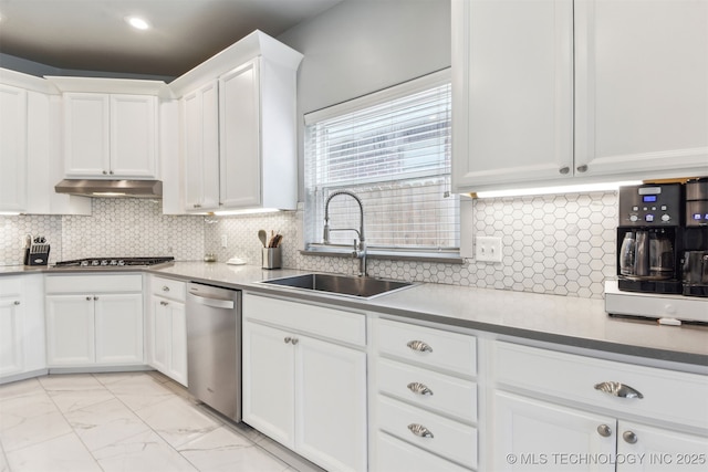 3909 W Utica St, Broken Arrow, OK 74011 - kitchen with stainless steel appliances, a sink, white cabinets, under cabinet range hood, and light marble finish floors