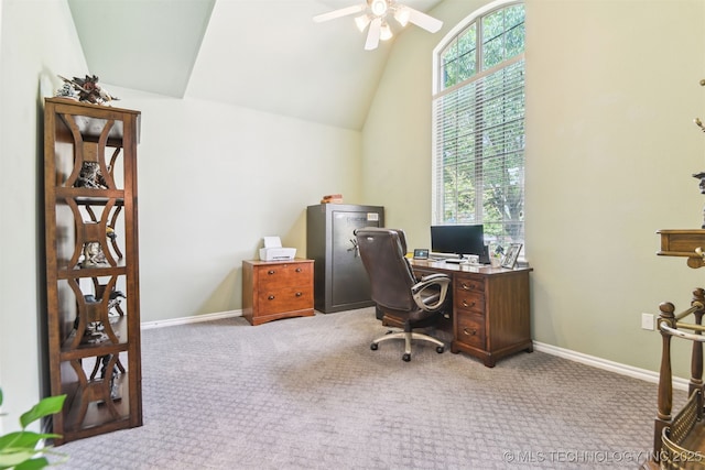 carpeted office space with a ceiling fan, high vaulted ceiling, and baseboards