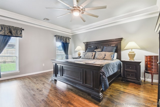 bedroom with ornamental molding, dark wood-style floors, baseboards, and ceiling fan