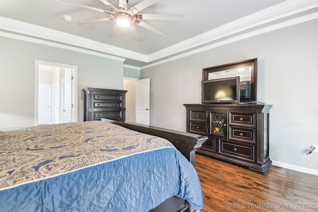 bedroom with dark wood-type flooring, ornamental molding, ceiling fan, and baseboards