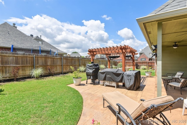view of yard with a pergola, a patio area, and a ceiling fan