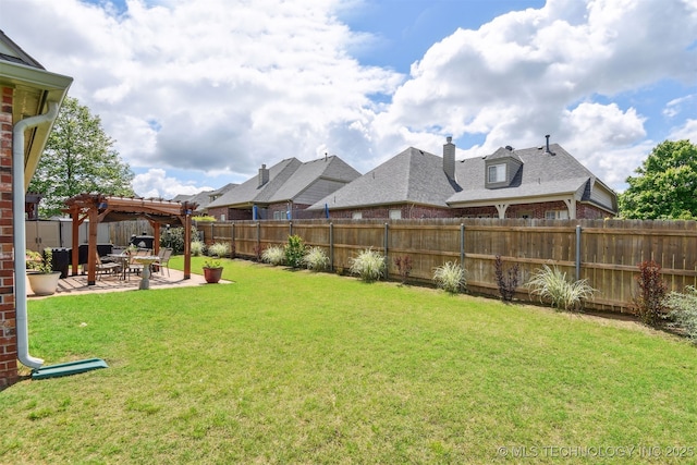 view of yard with a pergola and a patio area