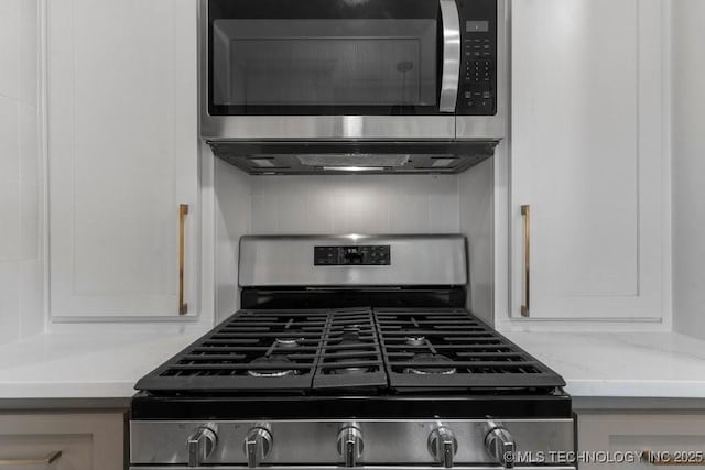 4723 E 8th St, Tulsa, OK 74112 - kitchen featuring stainless steel appliances and light stone counters