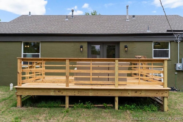 4723 E 8th St, Tulsa, OK 74112 - back of property featuring a shingled roof and a deck