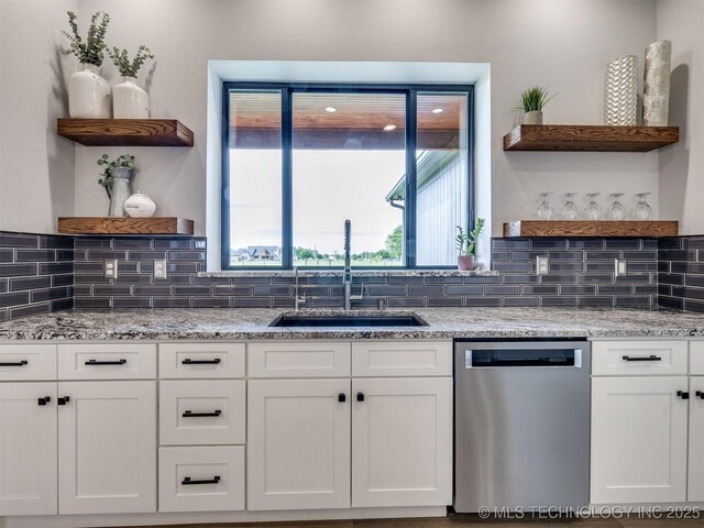 3241 E 171st St S, Bixby, OK 74008 - kitchen with open shelves, dishwasher, a sink, and white cabinetry