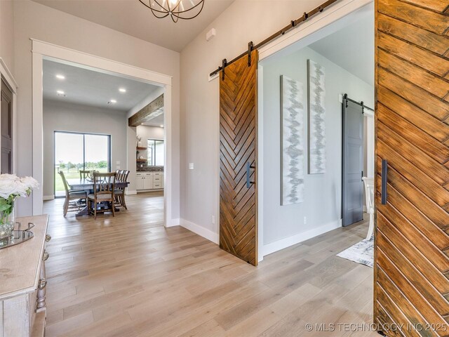 3241 E 171st St S, Bixby, OK 74008 - hallway with a barn door, light wood-style floors, baseboards, and recessed lighting