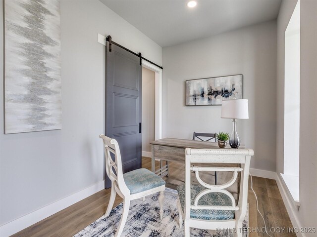 3241 E 171st St S, Bixby, OK 74008 - office area featuring a barn door, wood finished floors, and baseboards