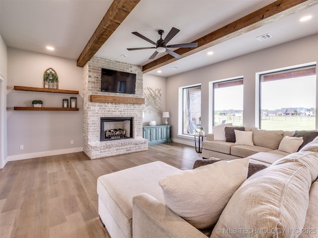 3241 E 171st St S, Bixby, OK 74008 - living area featuring beam ceiling, ceiling fan, wood finished floors, baseboards, and a fireplace