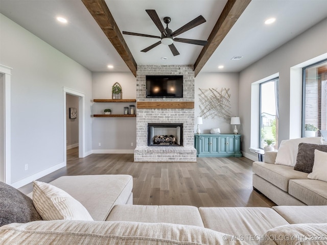 3241 E 171st St S, Bixby, OK 74008 - living area with a ceiling fan, beamed ceiling, wood finished floors, baseboards, and a fireplace