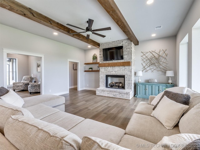 3241 E 171st St S, Bixby, OK 74008 - living room featuring beamed ceiling, ceiling fan, wood finished floors, a fireplace, and recessed lighting