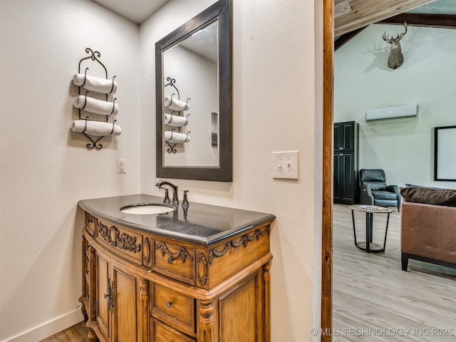 3241 E 171st St S, Bixby, OK 74008 - bathroom featuring a wall mounted air conditioner, wood finished floors, vanity, and baseboards