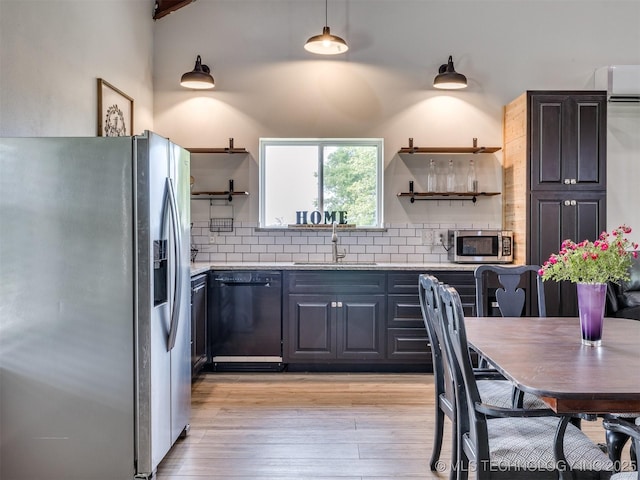 3241 E 171st St S, Bixby, OK 74008 - kitchen with appliances with stainless steel finishes, open shelves, a sink, and decorative backsplash