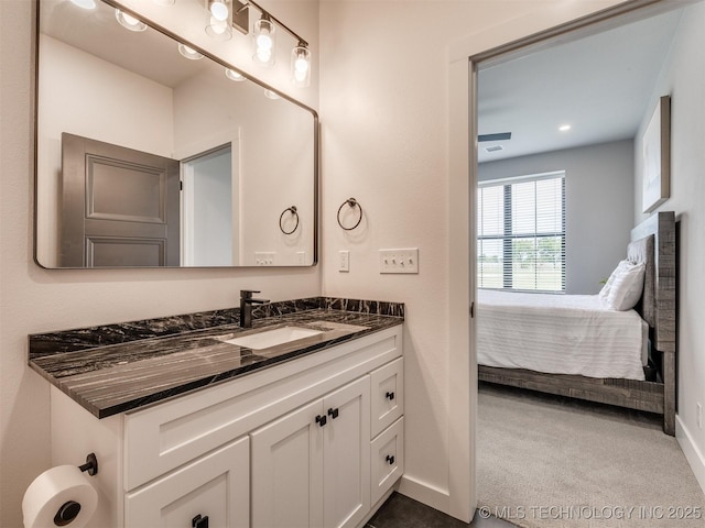 3241 E 171st St S, Bixby, OK 74008 - ensuite bathroom featuring vanity, baseboards, and recessed lighting