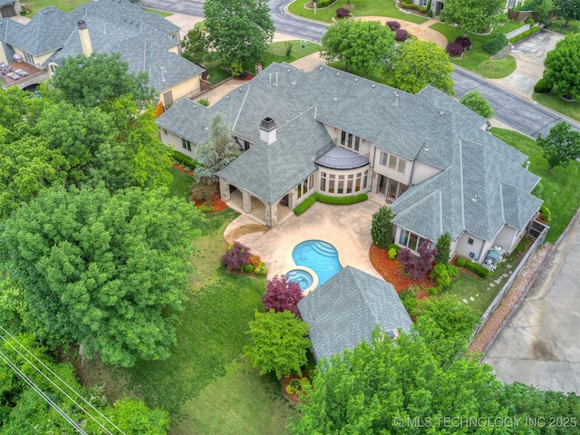 view of subject property featuring a pool area