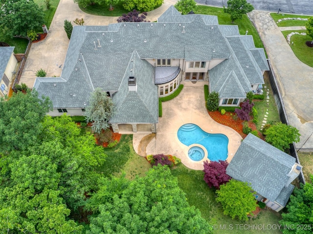 view from above of property with a pool area