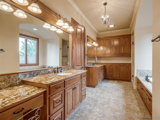 full bathroom with crown molding, a stall shower, a chandelier, two vanities, and a bath