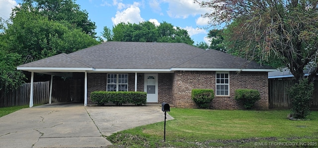 103 E Iola, Sallisaw, OK 74955 - ranch-style house with a carport, brick siding, driveway, and roof with shingles
