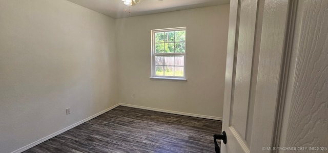 103 E Iola, Sallisaw, OK 74955 - empty room featuring dark wood-style flooring, baseboards, and ceiling fan