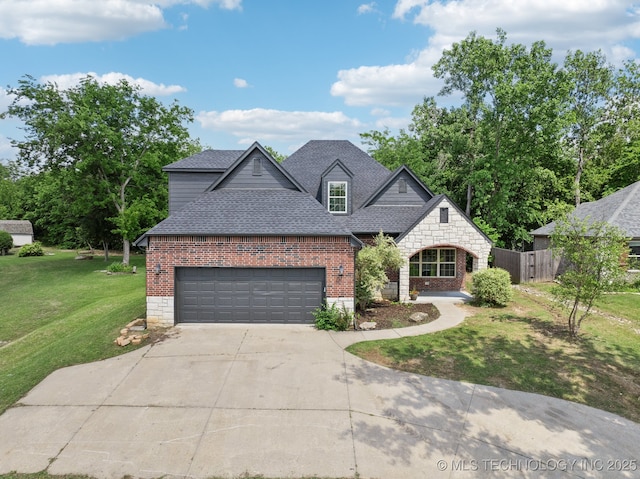 4805 S Mckinley Ave, Sand Springs, OK 74063 - view of front facade with roof with shingles, brick siding, driveway, and an attached garage