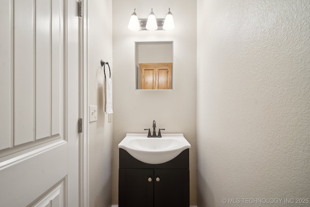 4805 S Mckinley Ave, Sand Springs, OK 74063 - bathroom featuring vanity and a textured wall