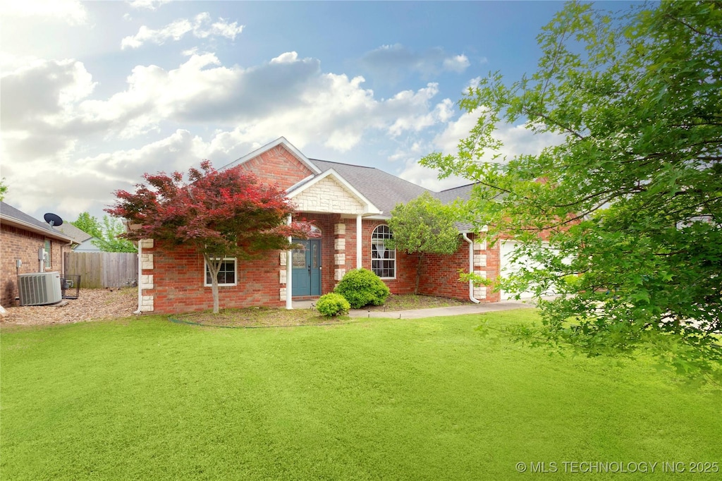 1408 Aspen, Mcalester, OK 74501 - view of front of home featuring central air condition unit, brick siding, and a garage